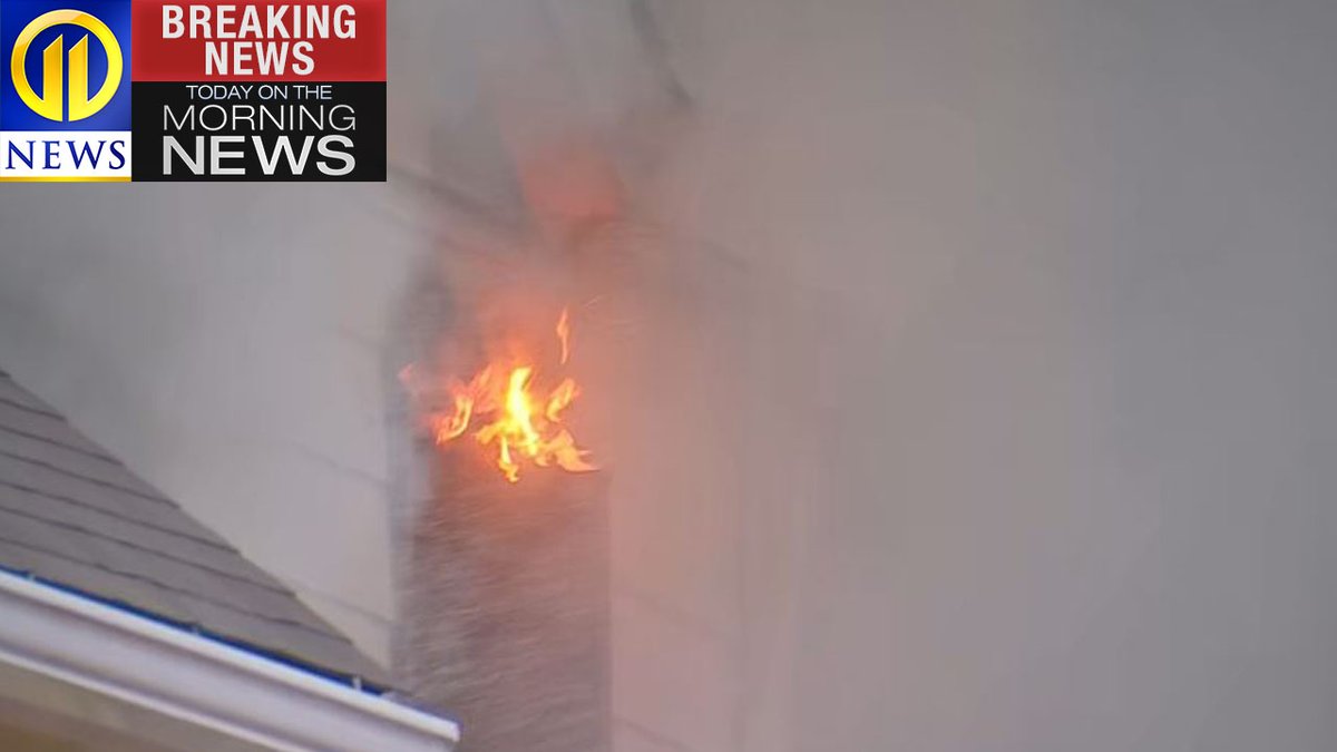 Flames and smoke shot from a house in McKees Rocks Friday morning. Firefighters were called about 6 a.m. to the fire on Bouquet Street