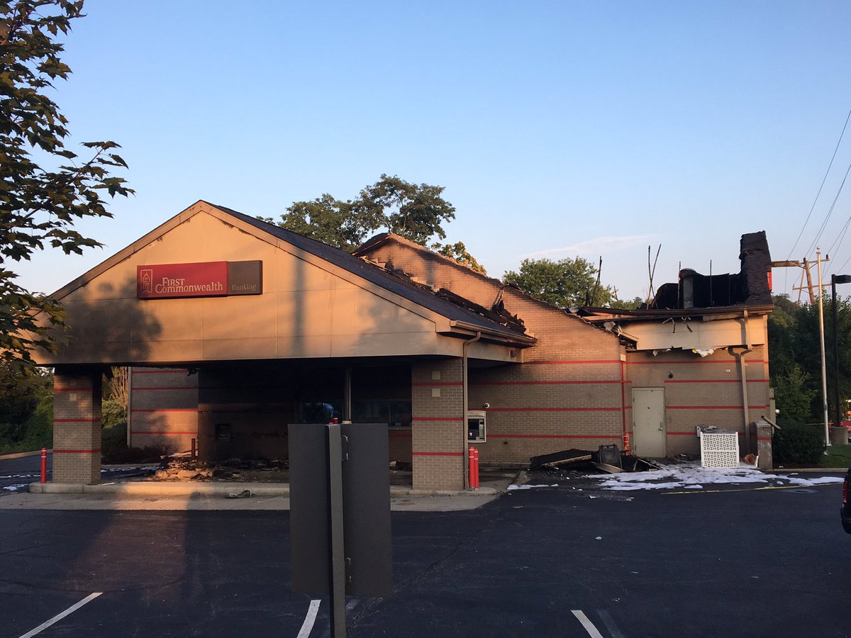 Armed guards are keeping  over this bank in Greentree-that was destroyed by fire. 