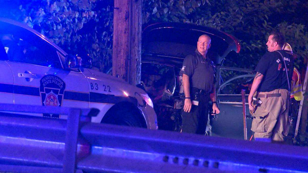 Two people hurt when vehicle hits pole, catches fire in Swissvale    