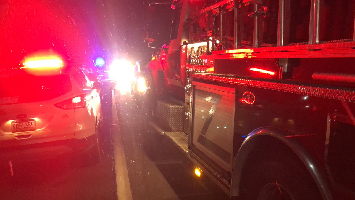 FATAL FIRE IN Mt Pleasant: on Route 31 next to Beacon Road—where emergency sources say coroner was called to a fatal fire. Someone was trapped inside.  This ambulance has a large group of people who walked away from street where fire happened. 