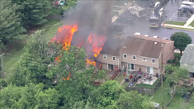 Three homes in Eagleville are on fire and police say there is man nearby firing a gun, possibly at helicopters over the scene.   Firefighters are fighting an exterior attack from a distance