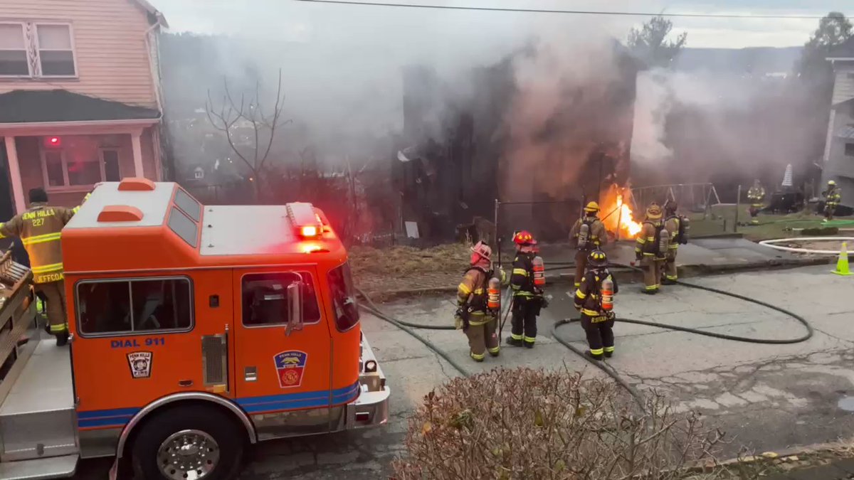 Crews battling a fire on Stokes Ave in Braddock. A neighbor across the street tells two people live there