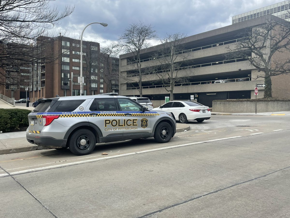 Large police presence outside Nova Place on the North Side.   I talked to several people who work inside who said they were walking to lunch in the plaza and encountered police officers with weapons drawn and K9s who told them to leave the area immediately