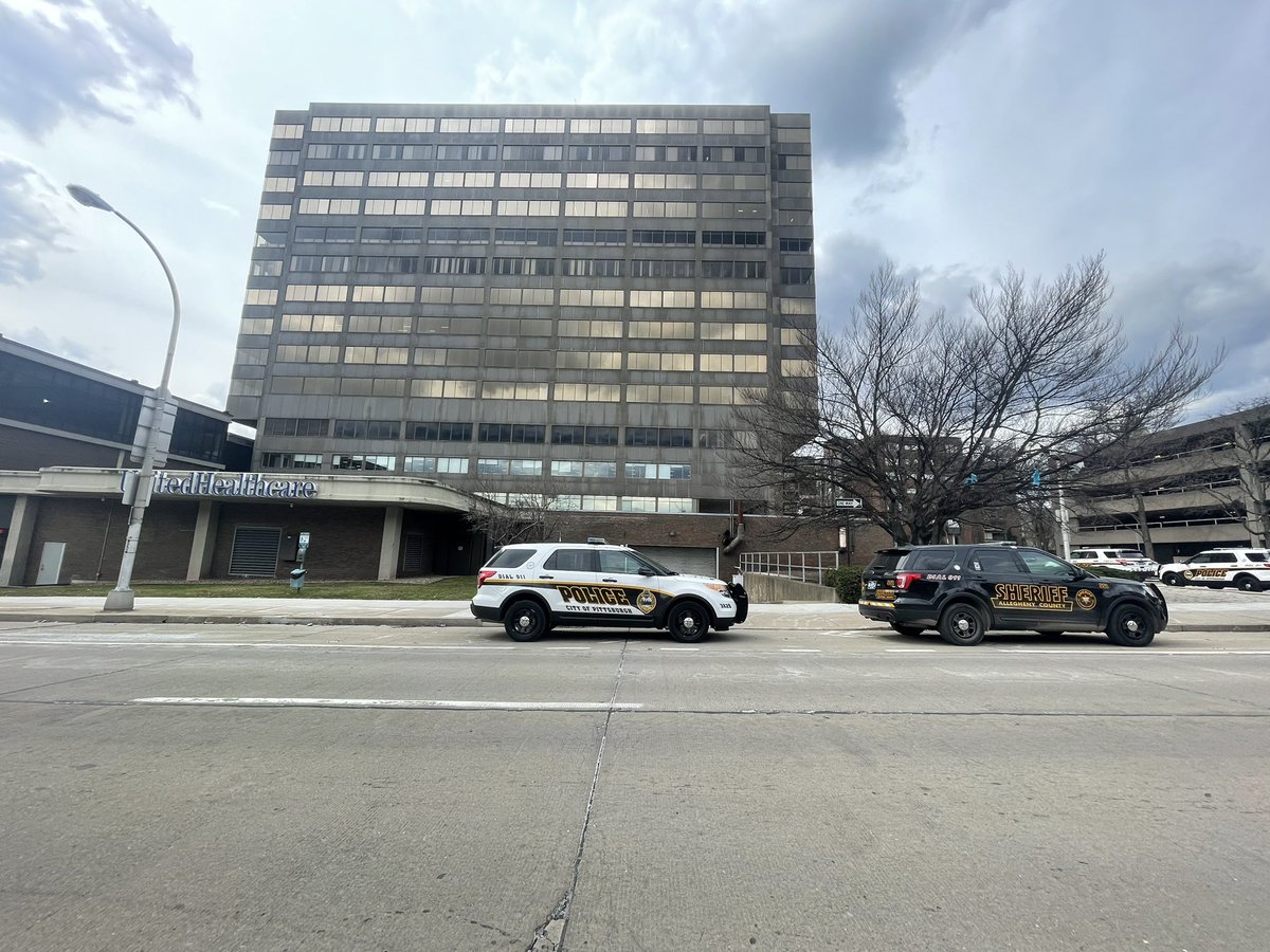 Large police presence outside Nova Place on the North Side.   I talked to several people who work inside who said they were walking to lunch in the plaza and encountered police officers with weapons drawn and K9s who told them to leave the area immediately