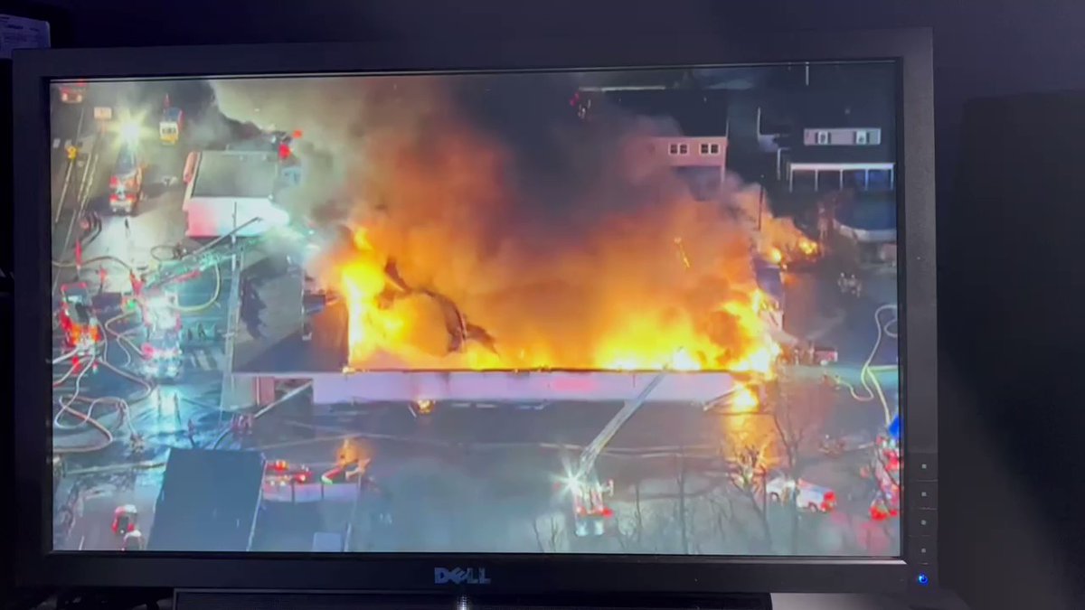 Heavy black smoke and flames can be seen coming from this bowling alley in Levittown, Pennsylvania