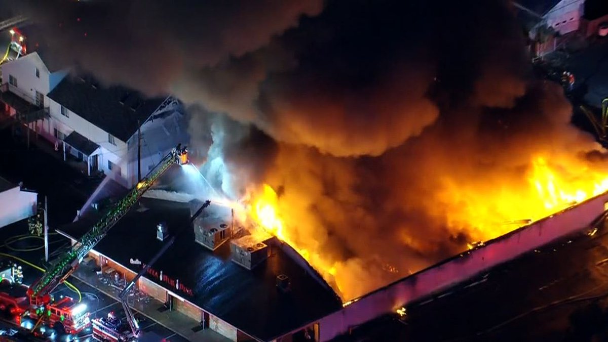 Fire crews are working to get control of a massive fire at Levittown Lanes Bowling Alley in Levittown, Bucks County.