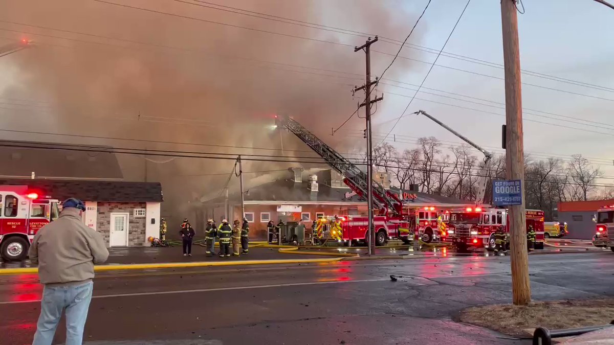 Levittown fire crews continue trying to get the bowling alley flames out