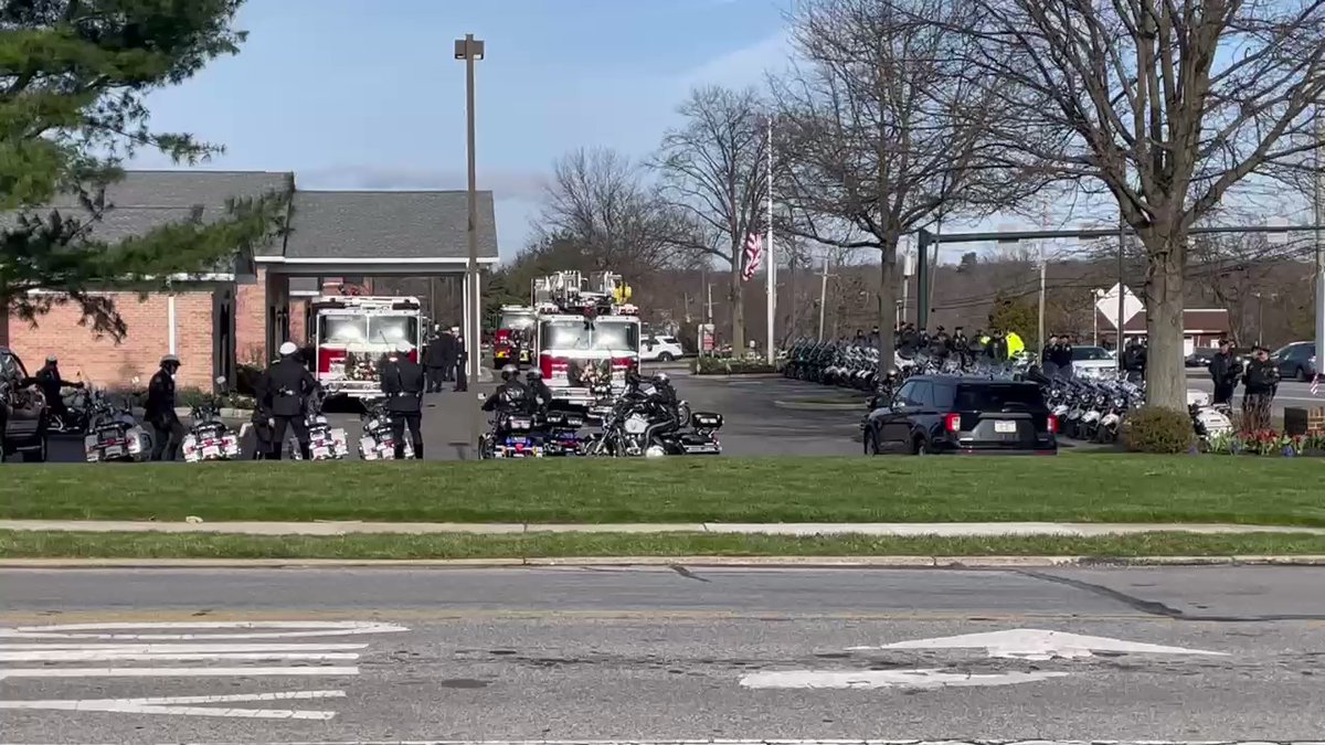 Outside the funeral home as dozens of officers prepare to escort Trooper Sisca's body to his funeral in Collegeville