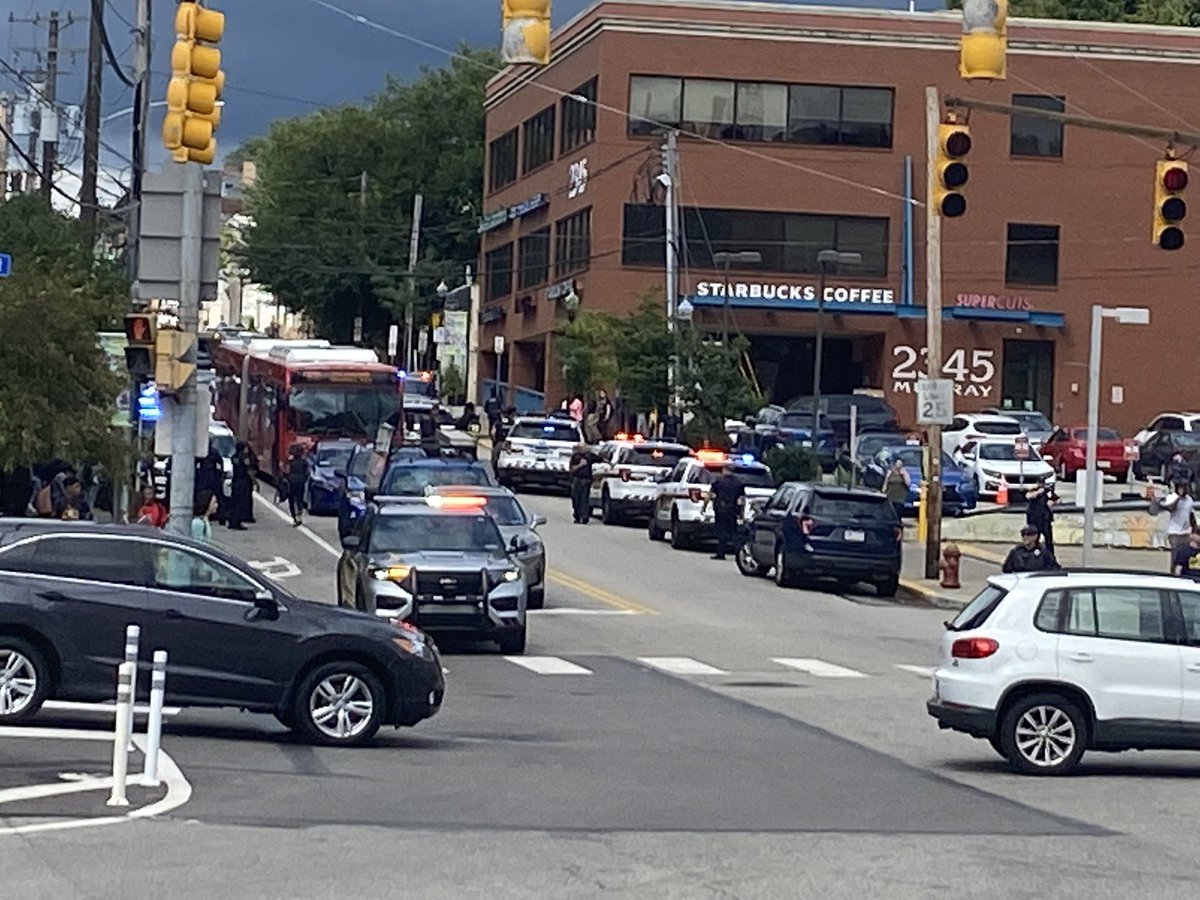 Dozens of kids and police remain at the corner of Murray Avenue and Forbes  Avenue where police say an officer was injured breaking up a fight 