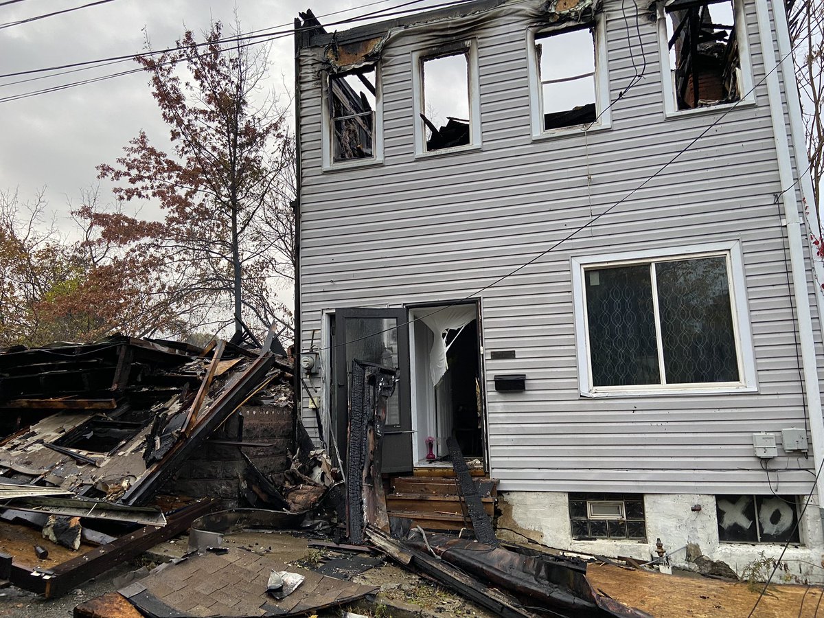 Massive flames ripped through a duplex on Iona St in Pittsburgh's Spring Hill neighborhood last night. Neighbors say one side was abandoned and a woman living in the other side was helped to safety