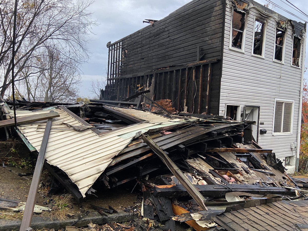 Massive flames ripped through a duplex on Iona St in Pittsburgh's Spring Hill neighborhood last night. Neighbors say one side was abandoned and a woman living in the other side was helped to safety