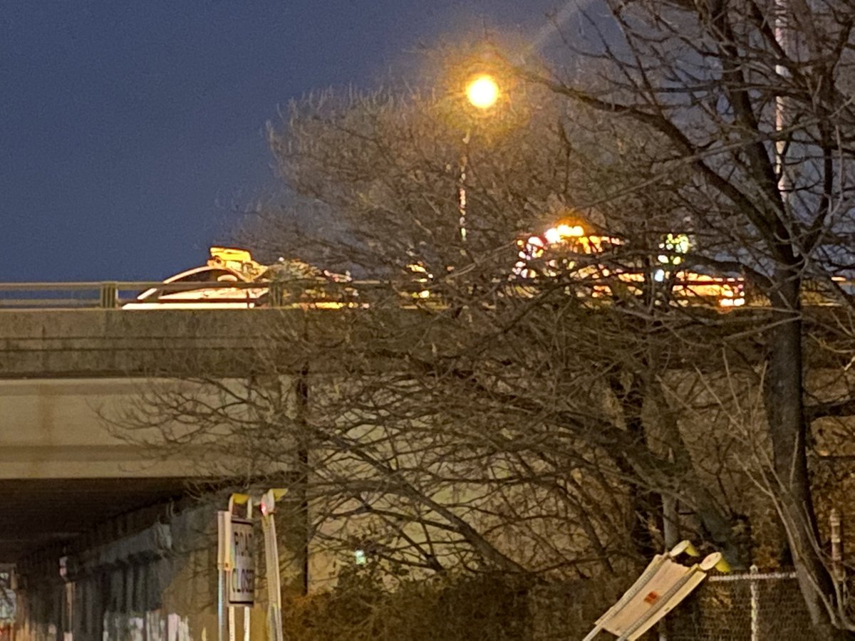 crews are towing away two wrecked vehicles involved in a deadly crash overnight on I-95 Northbound near Port Richmond. 