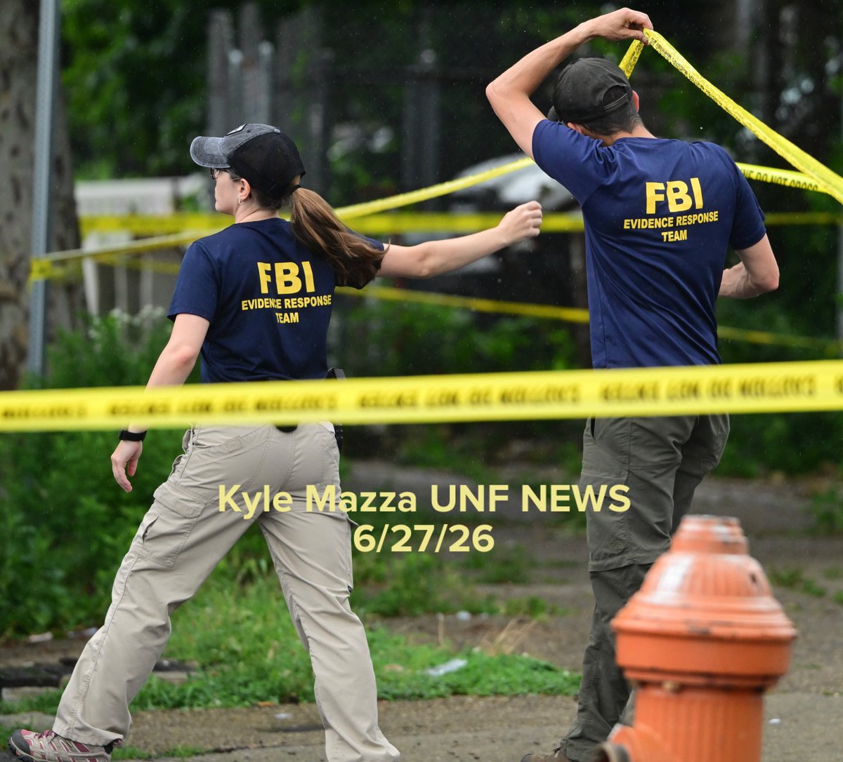 FBI agents collect evidence as they raid a home on the 400 block of West Chew Avenue in the Olney neighborhood in Philadelphia, Pennsylvania, United States on Saturday, June 27, 2026. Multiple law enforcement agencies, including Philadelphia police homicide detectives and the FBI, are conducting an investigation after chemicals, ammunition and drugs were found inside a home in Olney. 44-year-old Eugene Horsch is in custody on drug and firearms charges.